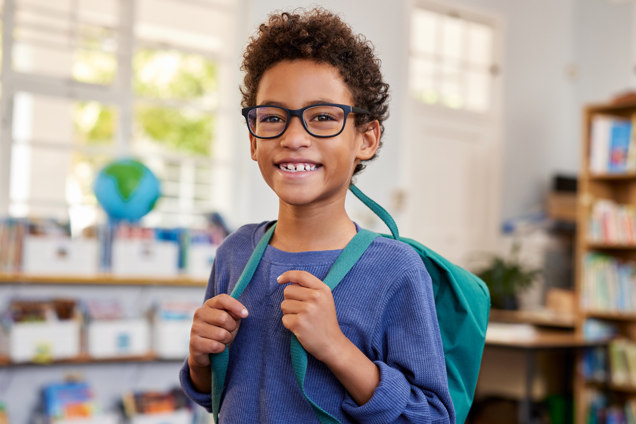 Child with glasses for vision program